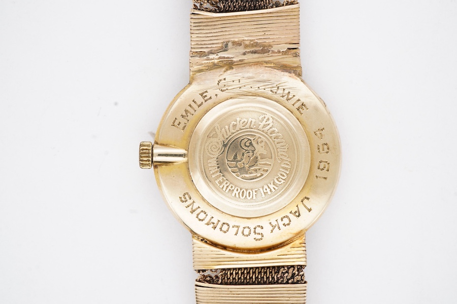 A gentleman's 1960's 14k Lucien Piccard manual wind wrist watch, with baton numerals and case back inscription, case diameter 27mm, on a damaged integral 14k bracelet.